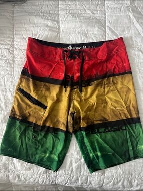 Pelagic Men’s Red, Yellow & Green Colorblock Board Shorts Tony Ludovico